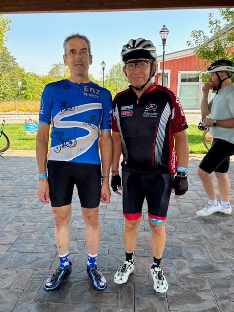 Two riders posing in ENY jerseys